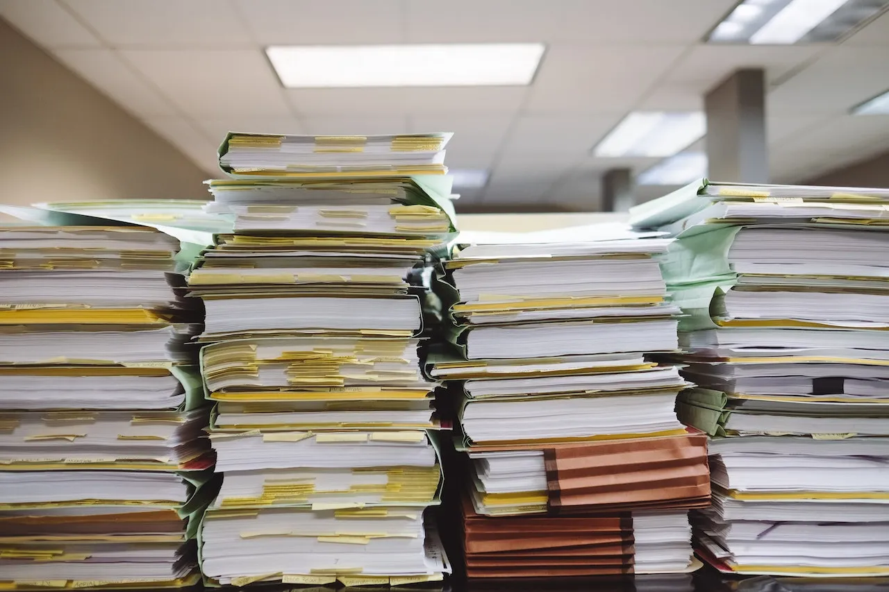 Office folders organized in tall stacks.